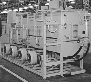 Figure 3. This industrial hydraulic power unit consists of five pump-motor assemblies supplied by an overhead hydraulic reservoir. The overhead mounting provides pressurized fluid to each pump's inlet, and mounting pump-motor assemblies offset from the reservoir provides access for lifting pump-motor assemblies from overhead.
