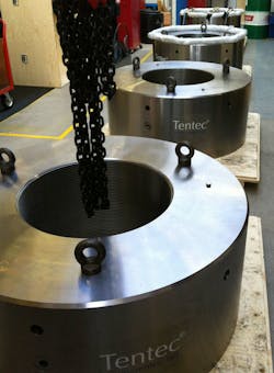 These four hydraulic bolts have been installed on a forging press and are the largest ever made by Tentec — and possibly by anyone. They fit a 25-in. threaded shaft and produce 8000 tons of axial force from 1500 psi hydraulic pressure. Tentec designed seals to deal with the challenge of deflection from high pressure applied to large surface areas. These four hydraulic bolts have been installed on a forging press and are the largest ever made by Tentec — and possibly by anyone. They fit a 25-in. threaded shaft and produce 8000 tons of axial force from 1500 psi hydraulic pressure. Tentec designed seals to deal with the challenge of deflection from high pressure applied to large surface areas.