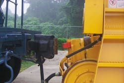 A weight-transfer coupler on a rail car mover approaches a standard coupler on car. A weight-transfer coupler on a rail car mover approaches a standard coupler on car.