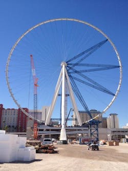 The High Roller observation wheel is shown under construction earlier this year in las Vegas. The outer rim has been completed, but additional radial spokes had not yet been added before removal of temporary radial support struts. The High Roller observation wheel is shown under construction earlier this year in las Vegas. The outer rim has been completed, but additional radial spokes had not yet been added before removal of temporary radial support struts.