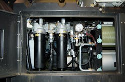 Open access panel reveals hydraulic components. White cylinder at extreme left is aerator. The tow black cylinders to its right are hydraulic filters, and the two large horizontal cylinders at far right are low-pressure accumulators., Photo by Alan Hitchcox. Open access panel reveals hydraulic components. White cylinder at extreme left is aerator. The tow black cylinders to its right are hydraulic filters, and the two large horizontal cylinders at far right are low-pressure accumulators., Photo by Alan Hitchcox.