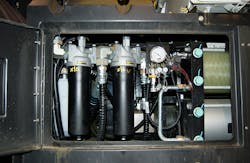 Open access panel reveals hydraulic components. White cylinder at extreme left is aerator. The tow black cylinders to its right are hydraulic filters, and the two large horizontal cylinders at far right are low-pressure accumulators., Photo by Alan Hitchcox. Open access panel reveals hydraulic components. White cylinder at extreme left is aerator. The tow black cylinders to its right are hydraulic filters, and the two large horizontal cylinders at far right are low-pressure accumulators., Photo by Alan Hitchcox.