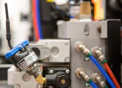 Parker Hannifin's SensoNODE Blue sensors can be applied to various points in the injection molding process to monitor and record data to provide analytics about a system's pressure, temperature, and humidity. Pictured here is a pressure sensor in the field. Parker Hannifin's SensoNODE Blue sensors can be applied to various points in the injection molding process to monitor and record data to provide analytics about a system's pressure, temperature, and humidity. Pictured here is a pressure sensor in the field.