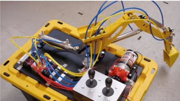 A microexcavator designed and built by CCEFP researchers is available for training and education to demonstrate the power and capability of hydraulics or pneumatics