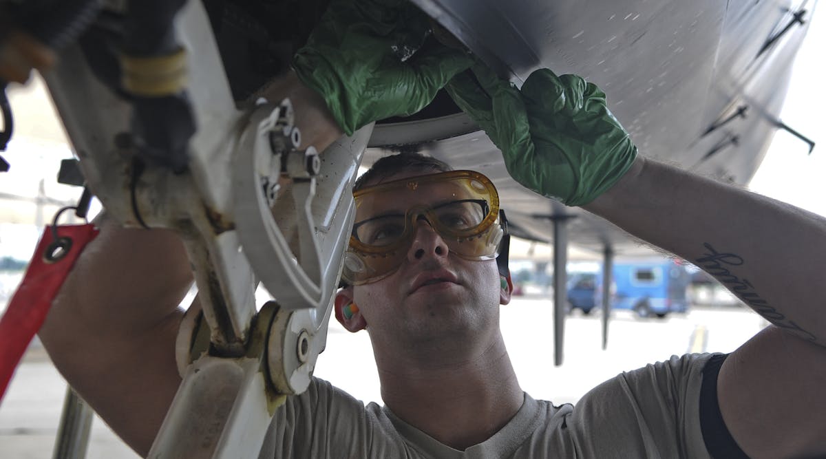 Senior Airman Christopher Pritchett, 4th Aircraft Maintenance Squadron crew chief, attaches a hydraulic line to an F-15E Strike Eagle, Oct. 1, 2015, at Seymour Johnson Air Force Base, North Carolina. Aircraft assigned to the 4th Fighter Wing and 916th Air Refueling Wing were repositioned to Barksdale AFB, Louisiana, in preparation for Hurricane Joaquin&rsquo;s possible landfall. (U.S. Air Force photo/Senior Airman Aaron J. Jenne)