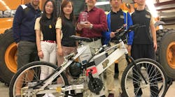 The winners of the 2017 Vehicle Challenge pose for a picture with their chainless bicycle, the Purdue Tracer, which is powered using a hydraulic pump and motor.