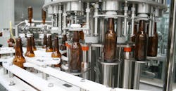 All the cylinders and valves on this bottling machine could exceed workplace noise and emissions requirements. But pneumatic silencers, coalescing silencers, and oil-free pneumatic systems produce a clean and relatively quiet work environment.