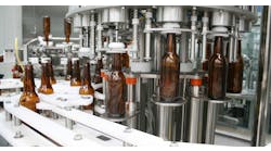 All the cylinders and valves on this bottling machine could exceed workplace noise and emissions requirements. But pneumatic silencers, coalescing silencers, and oil-free pneumatic systems produce a clean and relatively quiet work environment.
