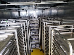 Using disposable dishware, the engineering team tests runs the MTU Sanitizer, which uses commercial baking trays and racks to hold personal protection equipment (PPE). Using disposable dishware, the engineering team tests runs the MTU Sanitizer, which uses commercial baking trays and racks to hold personal protection equipment (PPE).