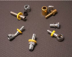 Fittings come in a variety of styles including tube stub fitting with nut and ferrule (upper left), conventional barbed fitting requiring external clamp or crimp sleeve (upper fight), JIC elbow fitting (lower left), straight push-lock to JIC male fitting (center bottom), and banjo fitting with bolt and seal washers (center bottom).