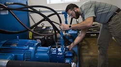 Technician checking seals Technician checking seals