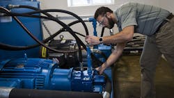 Technician checking seals Technician checking seals