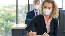 Office workers wearing facemasks