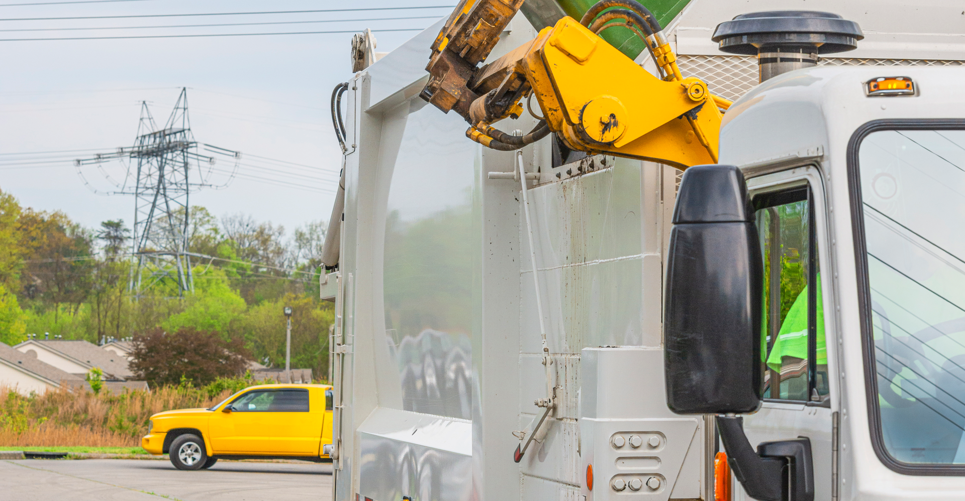 Robotic arm dumps trash