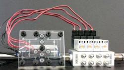 An eight-bit pneumatic RAM chip used to help a soft robot control its movements. The chip uses microfluidic valves to control airflow instead of electronic transistors. An eight-bit pneumatic RAM chip used to help a soft robot control its movements. The chip uses microfluidic valves to control airflow instead of electronic transistors.