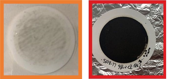 These filter pads were put in the new zinc-based hydraulic fluid (left) and the other in a poorly performing zinc based hydraulic oil (right), both for 1,000 hr. The pad exposed to the new fluid appears clear, while the pad exposed to a poorly performing zinc-base oil is caked with black sludge. This indicates that not all zinc-based hydraulic oils are the same with respect to sludge formation.
