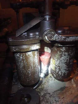 Leak being funneled back into the machine. Leak being funneled back into the machine.