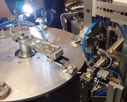 Pneumatically powered grippers move parts from one manufacturing process to another. Pneumatically powered grippers move parts from one manufacturing process to another.