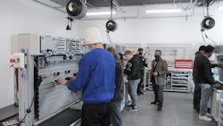 Cristobel Jiménez, master trainer at Festo Didactic, teaches mechatronics to high school seniors at the Festo facility in Mason, Ohio. Cristobel Jiménez, master trainer at Festo Didactic, teaches mechatronics to high school seniors at the Festo facility in Mason, Ohio.