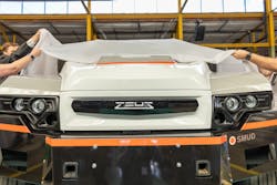 The Zeus Electric Chassis Class 5 all-electric work truck was unveiled at the CMC, marking the first commercial transaction between two of the center's members. The Zeus Electric Chassis Class 5 all-electric work truck was unveiled at the CMC, marking the first commercial transaction between two of the center's members.