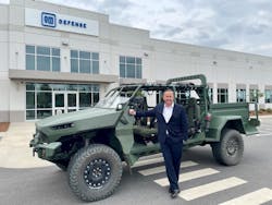 GM Defense CEO Steve duMont stands aside the All-Electric Military Concept Vehicle at the company&apos;s Concord, N.C. production facility.