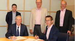 Executives from the companies signing the acquisition agreement Executives from the companies signing the acquisition agreement