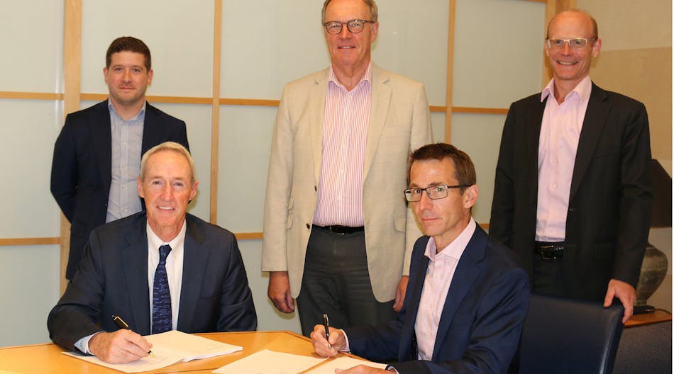 Executives from the companies signing the acquisition agreement