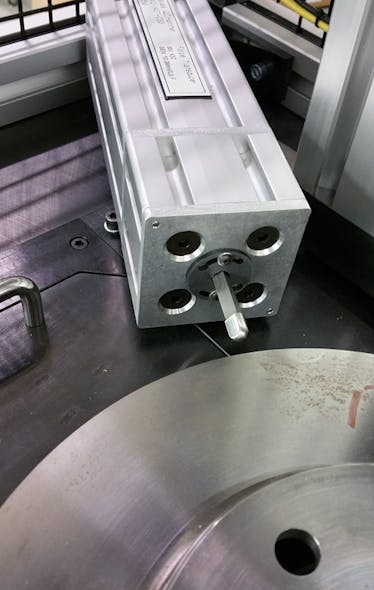 Cracks, flaws, and other anomalies can be identified through frequency inspection. Here a force is applied to a brake rotor to measure its resonance frequency.