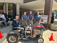Electrical engineering students at MSOE showcase their tractor which was converted to electric power.