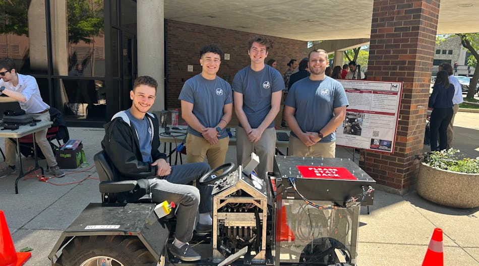 Electrical engineering students at MSOE showcase their tractor which was converted to electric power.