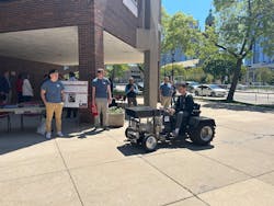 MSOE students who electrified a tractor for their senior project provided a demo of the tractor which they said ran quieter than the previous engine-driven version.