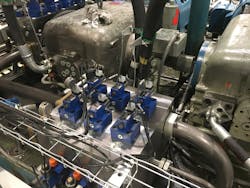 Switching to a manifold system for the GEI extrusion press helped to reduce dead cycle time by three seconds as well as system shock and hydraulic fluid leakage.