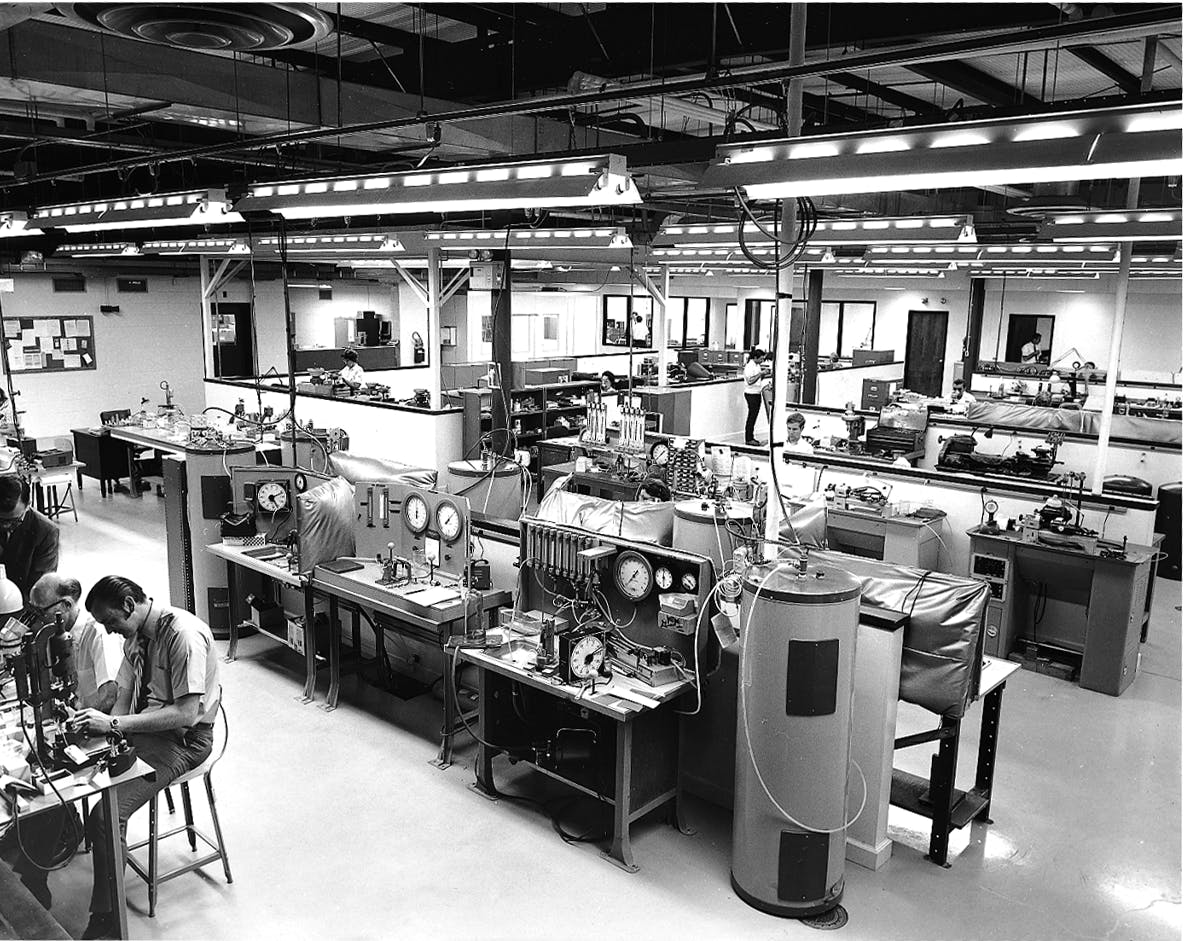 A room full of testing stations at The Lee Company in the 1960s aided product development for the fluid power industry.