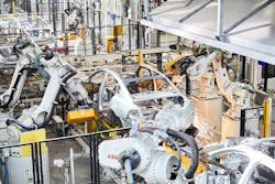 Robots aiding production of cars Robots aiding production of cars
