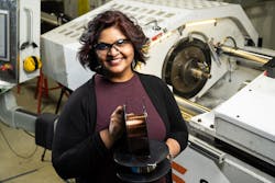 Keerti Kappagantula shows off the highly conductive copper-graphene composite wiring she developed with her colleagues.