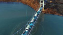 a depiction of connected autonomous vehicles on roadway a depiction of connected autonomous vehicles on roadway