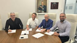 Company leaders at the signing of Brennan Industries' acquisition of Coterflex Industrial Company leaders at the signing of Brennan Industries' acquisition of Coterflex Industrial