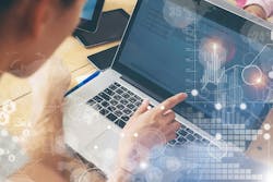 An engineer looking at data on a computer screen An engineer looking at data on a computer screen