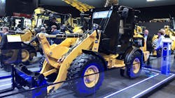 An electric construction machine on display at a trade show An electric construction machine on display at a trade show