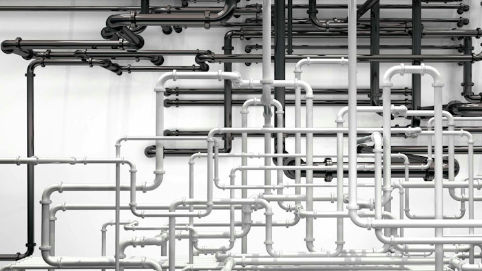 Pipes going in various directions to deliver compressed air to pneumatic systems