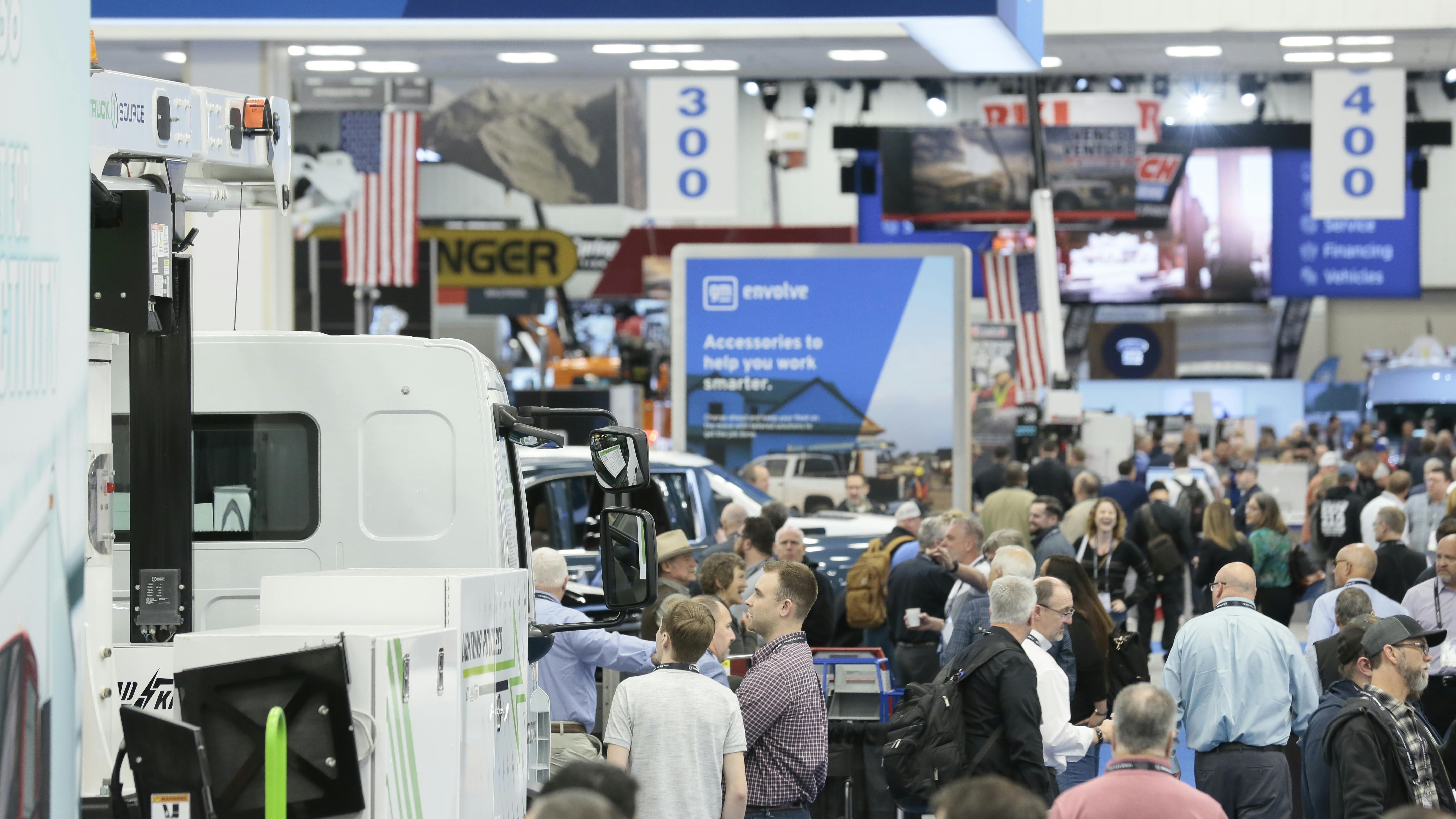 A crowd of people on the exhibit floor of the Work Truck Week trade show