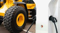A close up on the wheels of a construction machine and an electric vehicle charger next to it A close up on the wheels of a construction machine and an electric vehicle charger next to it