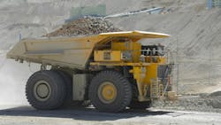 A mine haul truck carrying material across a mine site A mine haul truck carrying material across a mine site