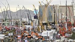 An aerial view of an outdoor exhibition lot at CONEXPO 2023 with various types of construction machines An aerial view of an outdoor exhibition lot at CONEXPO 2023 with various types of construction machines