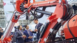 A close up view of hydraulic components on a construction machine on display at a trade show A close up view of hydraulic components on a construction machine on display at a trade show