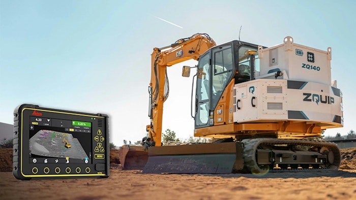 A machine display for a control system next to an excavator