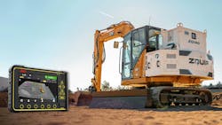 A machine display for a control system next to an excavator A machine display for a control system next to an excavator