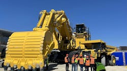 A large mining excavator on display at a trade show A large mining excavator on display at a trade show