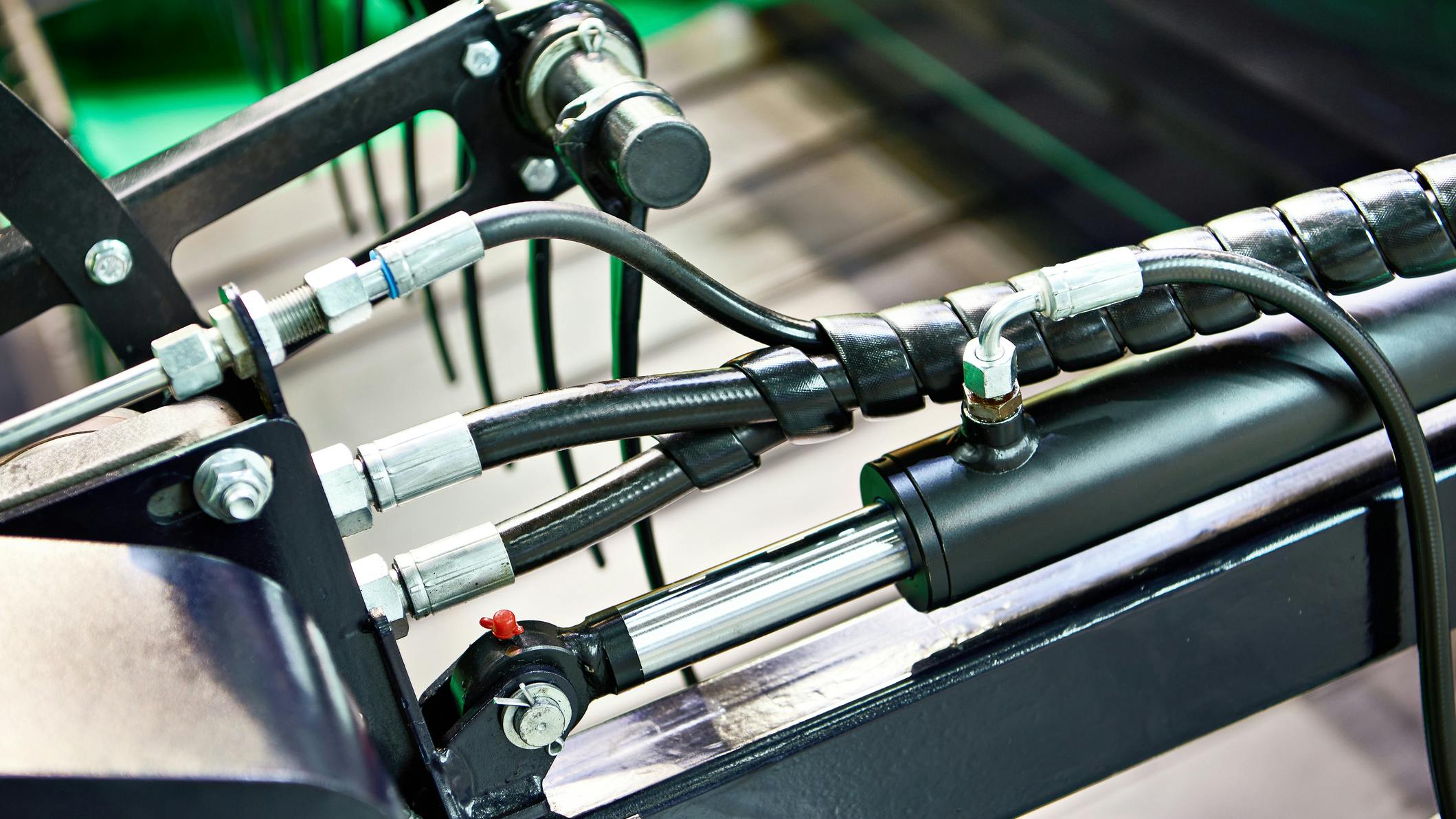 An image of hydraulic hoses, connectors and other hydraulic components on a machine