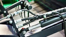 An image of hydraulic hoses, connectors and other hydraulic components on a machine An image of hydraulic hoses, connectors and other hydraulic components on a machine